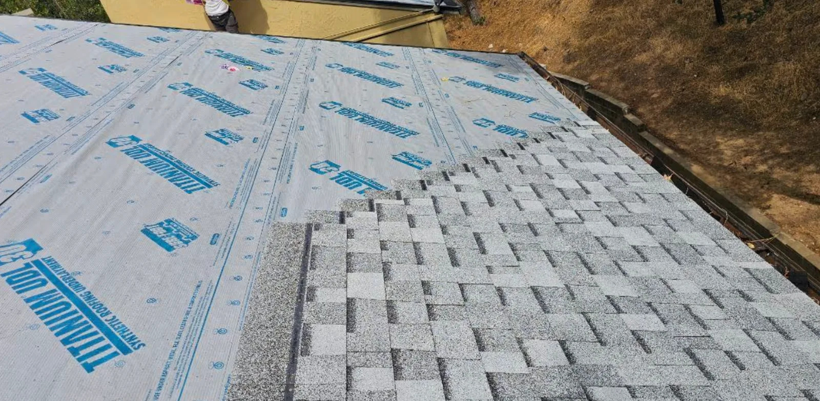 Completed apartment shingle roof installation by Higher Level Roofing