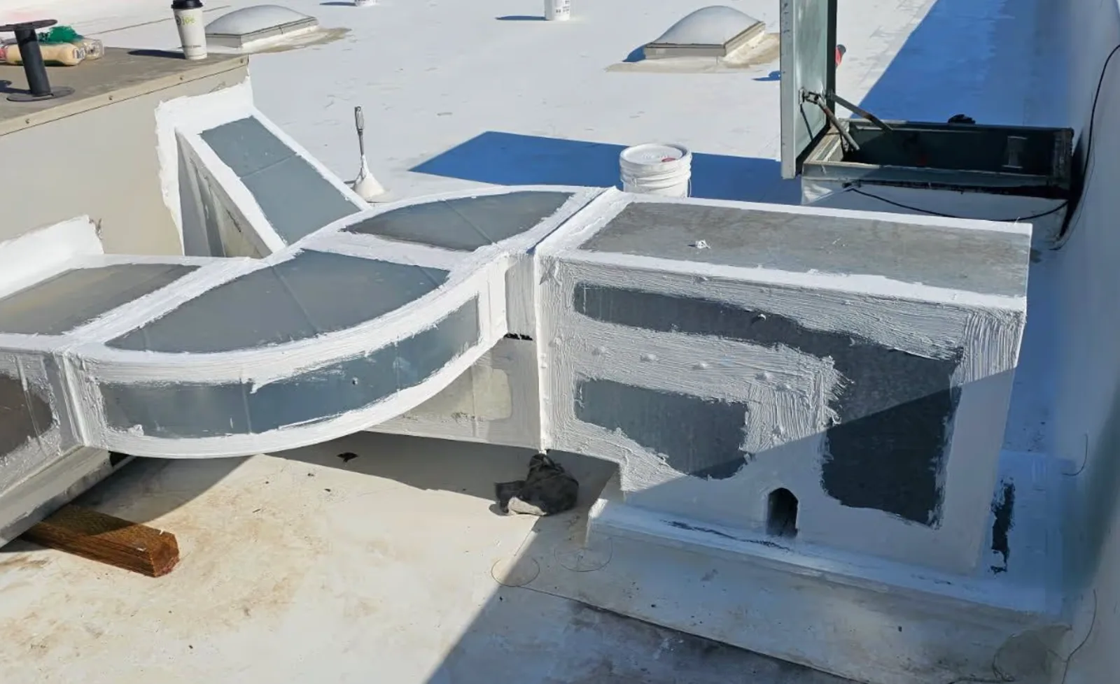Rooftop HVAC unit sealing on a commercial roof